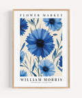 Vintage floral wall art featuring blue cornflowers and green leaves
