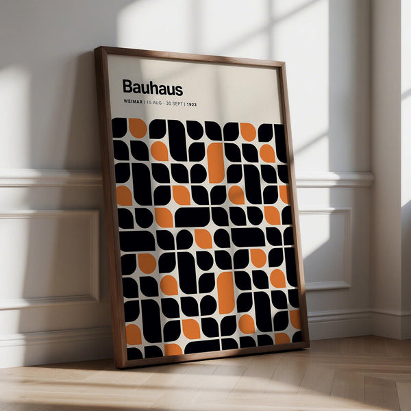 Bauhaus pattern wall art in bold black and orange geometric layout.