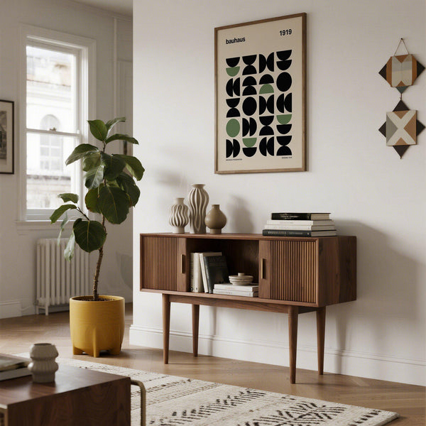 Minimalist gallery print styled in a creative studio with neutral furniture.