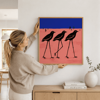 Desert Bird Wall Art illustration of three birds standing tall in a sparse landscape