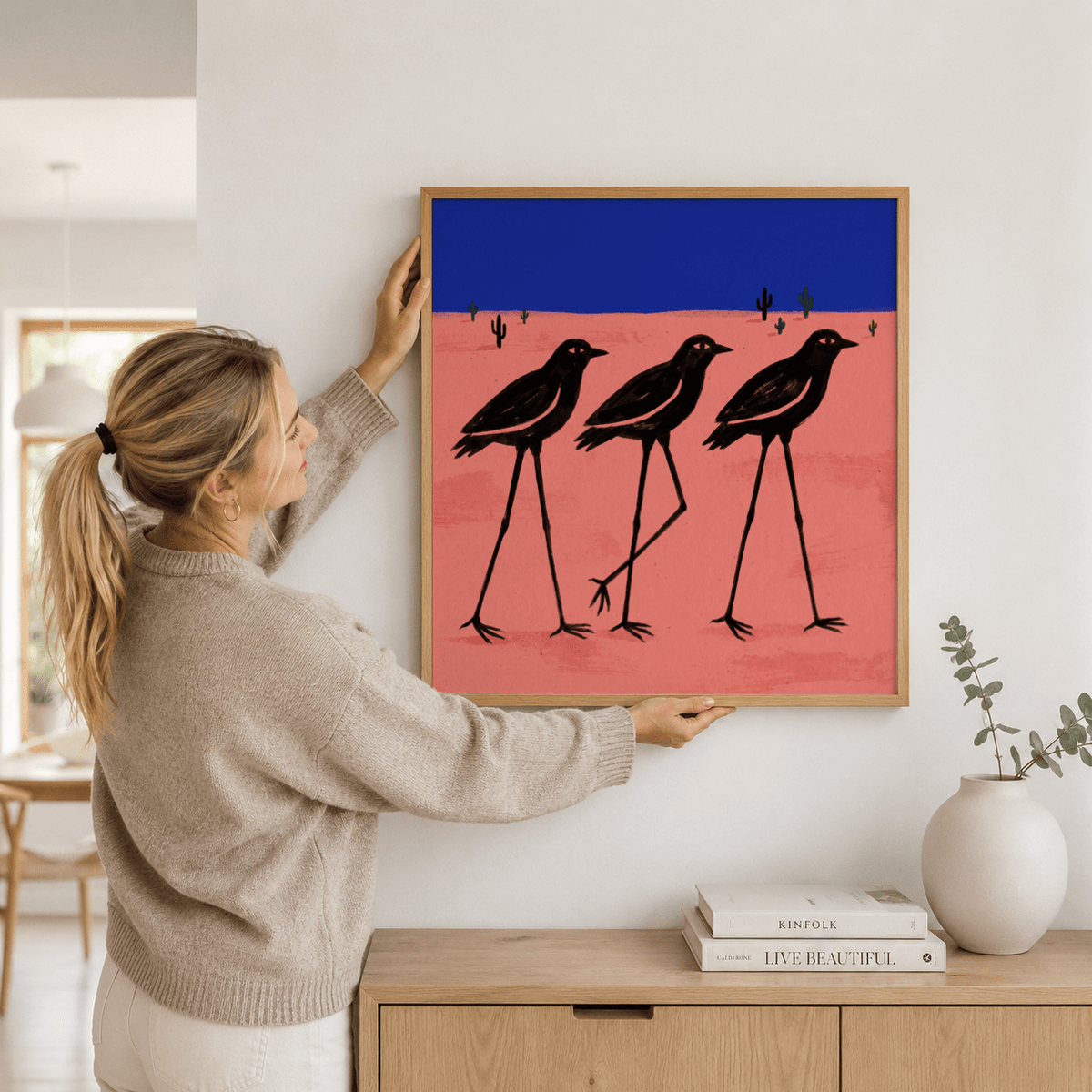 Desert Bird Wall Art illustration of three birds standing tall in a sparse landscape