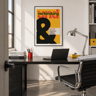 Ampersand on mustard yellow print above a desk in a home office