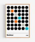 Abstract Bauhaus dots poster featuring bold circles in black and orange for minimalist wall art