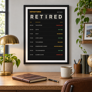 Black split flap board print in a study filled with travel books