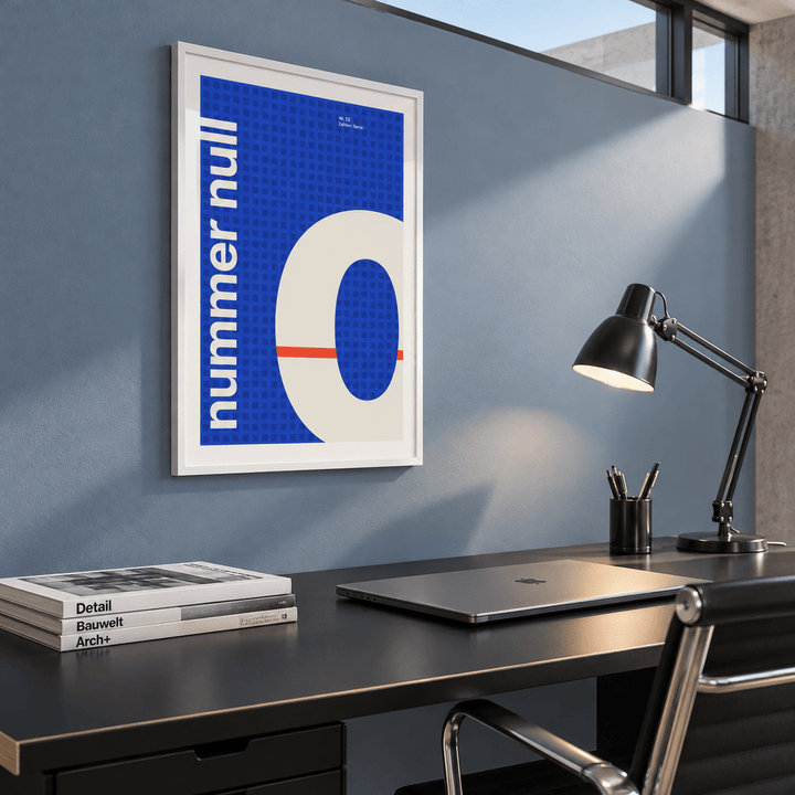 Number zero typography print above a desk in a home office