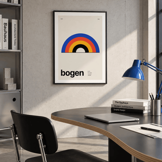 Cobalt red and mustard arches print above a desk in a home office