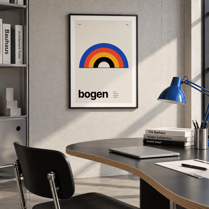 Cobalt red and mustard arches print above a desk in a home office