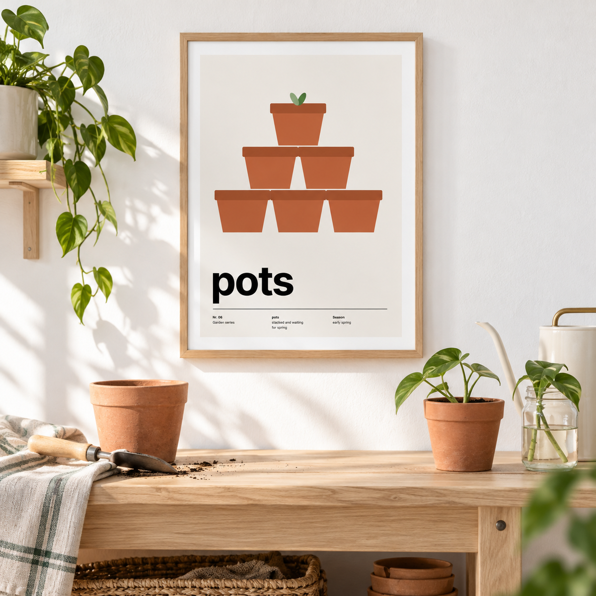 Pyramid of stacked terracotta pots above a potting bench beside terracotta pots