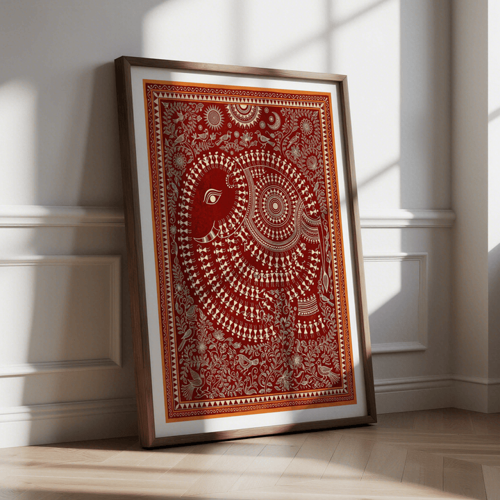 Indian Folk Art Poster leaning against a wall with sunlight showcasing a decorative red and cream elephant print