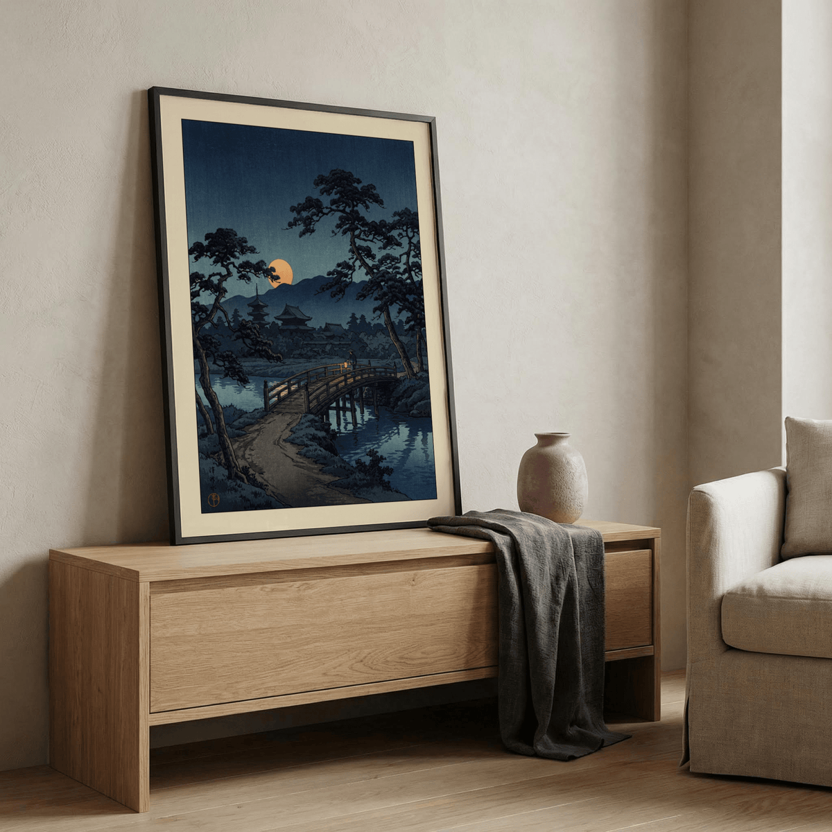 Japanese-inspired wall art with lantern light reflecting on water