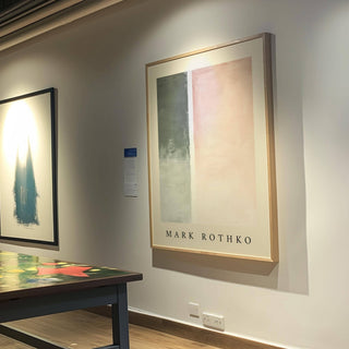 Office decor featuring muted green and pink art wall painting