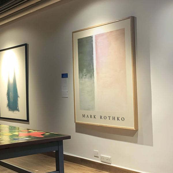 Office decor featuring muted green and pink art wall painting