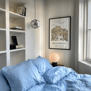 Colorful townhouses flanking wide boulevard in perspective architecture poster design