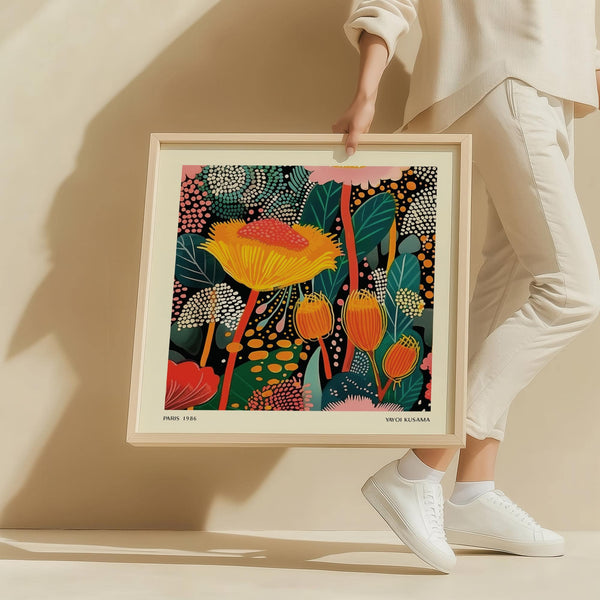 Living room wall styled with Kusama floral prints for framing