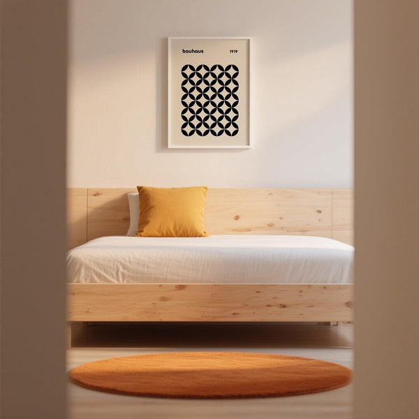 Contemporary mid century wall print with black circular pattern on cream-colored background.