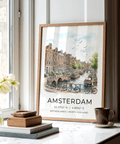 City travel poster print showing canal boats, trees, and Amsterdam lettering
