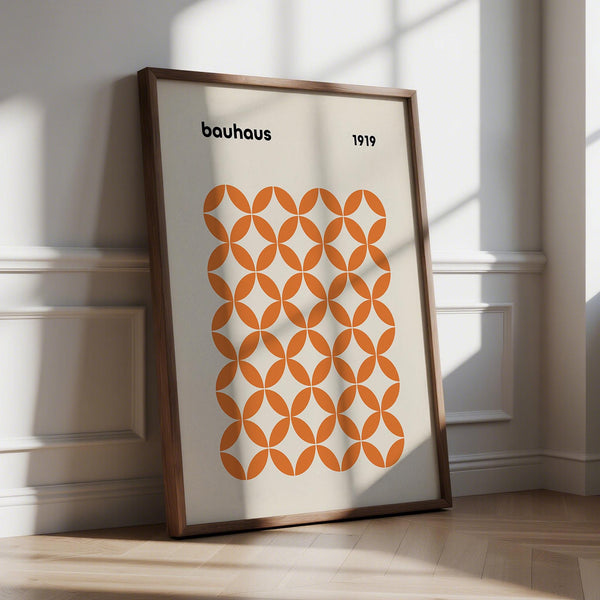 Orange minimalist print with intersecting circle pattern in bold Bauhaus style.