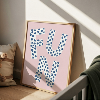 Playful typography wall art print showing the word FUN with blue polka dots