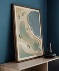 Simplified golf course wall art featuring a round green, nearby bunker, and scattered trees