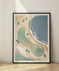 Graphic seaside golf course print with putting green, red flag, sand bunker, and wave edge
