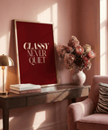 Red background poster presenting the words “CLASSY NEVER QUIET” in stacked layout