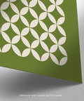 Mid century geometric Bauhaus circle pattern print on olive green background.