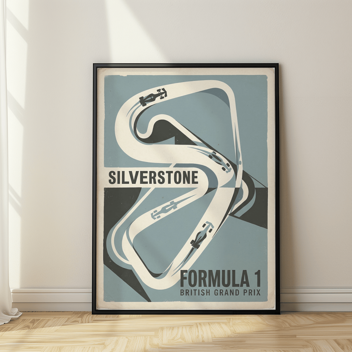 Graphic race track outline wall art print with car silhouettes and bold Silverstone lettering