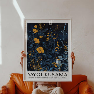 Bold orange and blue wall art featuring stylized flowers and dotted texture