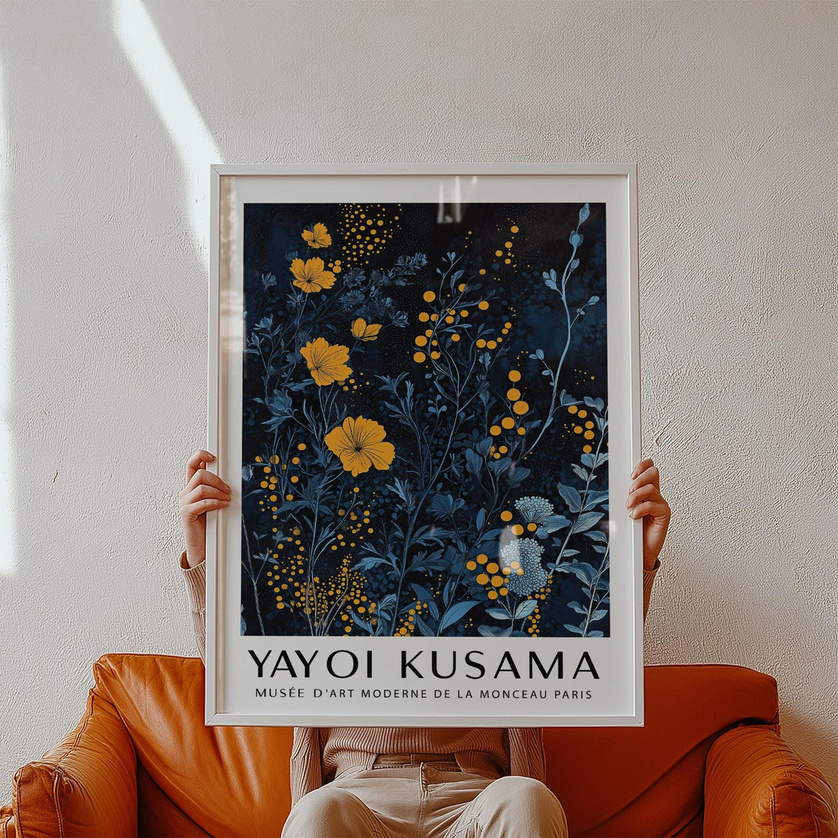 Bold orange and blue wall art featuring stylized flowers and dotted texture