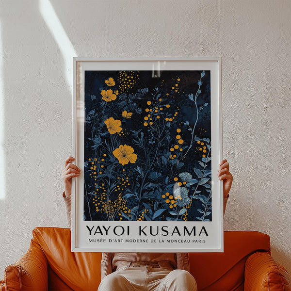 Bold orange and blue wall art featuring stylized flowers and dotted texture