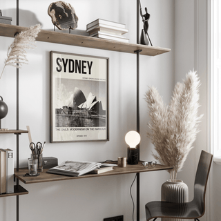 Sydney Opera House Art Print hanging in minimalist workspace with beige accents
