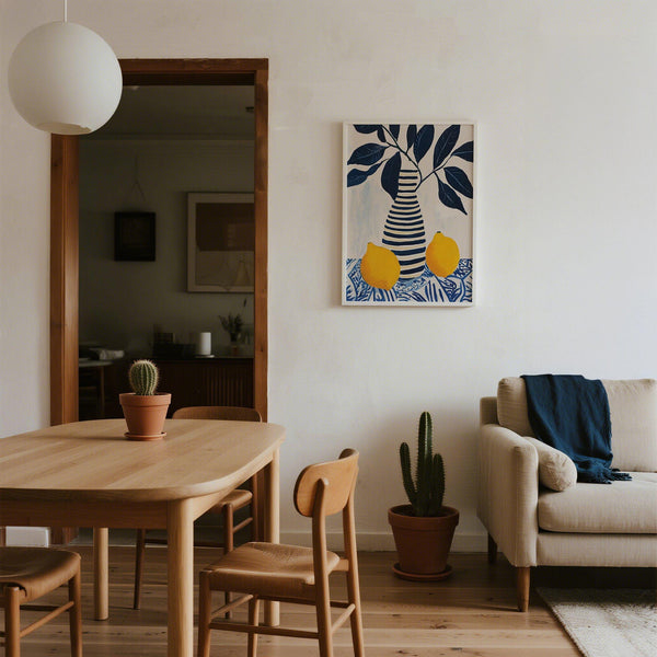 Modern lemon art showing yellow fruit beside bold blue foliage and a patterned cloth.