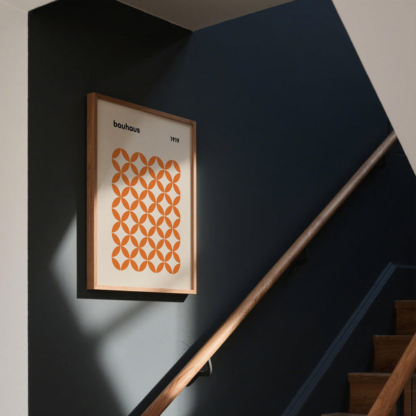 Abstract orange minimalist print featuring geometric repetition on neutral background.