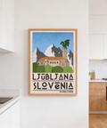 Stylized landscape print of Ljubljana skyline framed by neat border and bold text