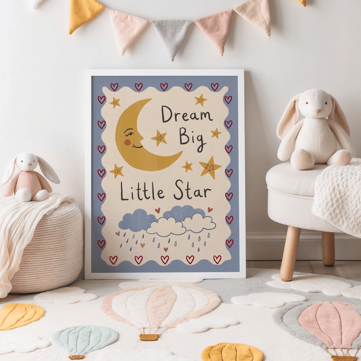Dream Big Poster leaning on the floor with a smiling moon and stars and soft pastel toys nearby