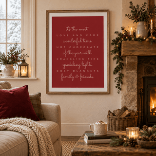 Red and cream Christmas quote print in a country living room at Christmas