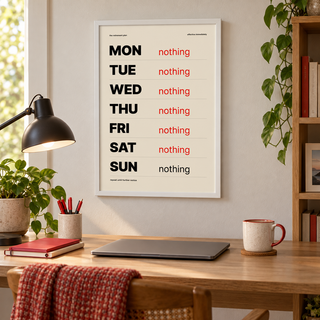 Funny retirement plan print above a tidy workspace in a home office