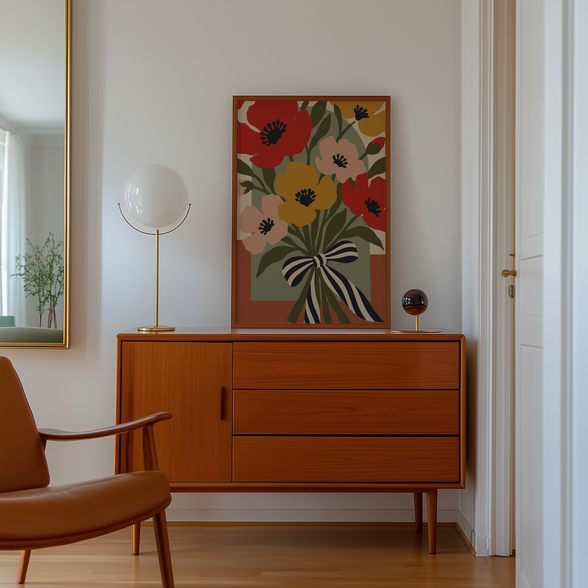 Cut paper poppies on a sage arch above a mid century sideboard in a hallway
