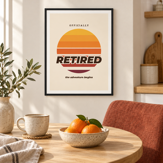 Officially retired sunset print above a bench in a breakfast nook