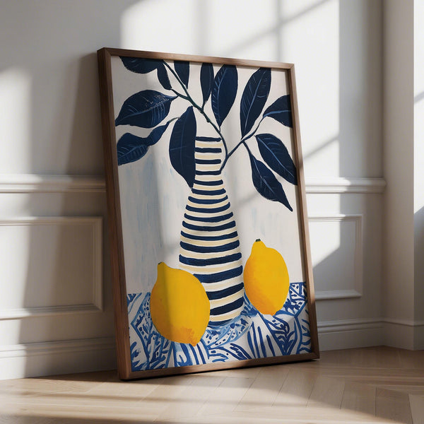 Lemon art print featuring two yellow lemons and navy blue leaves in a striped vase.
