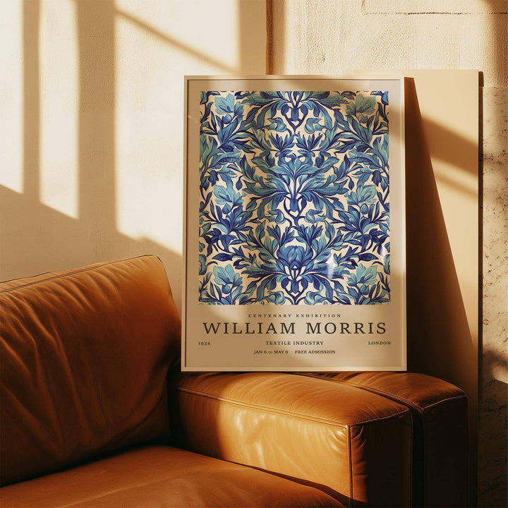Vintage wall art decor with an indigo floral pattern on a leather sofa arm