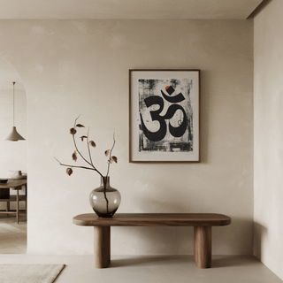 Framed Abstract Om Art Print leaning on shelf with meditation props