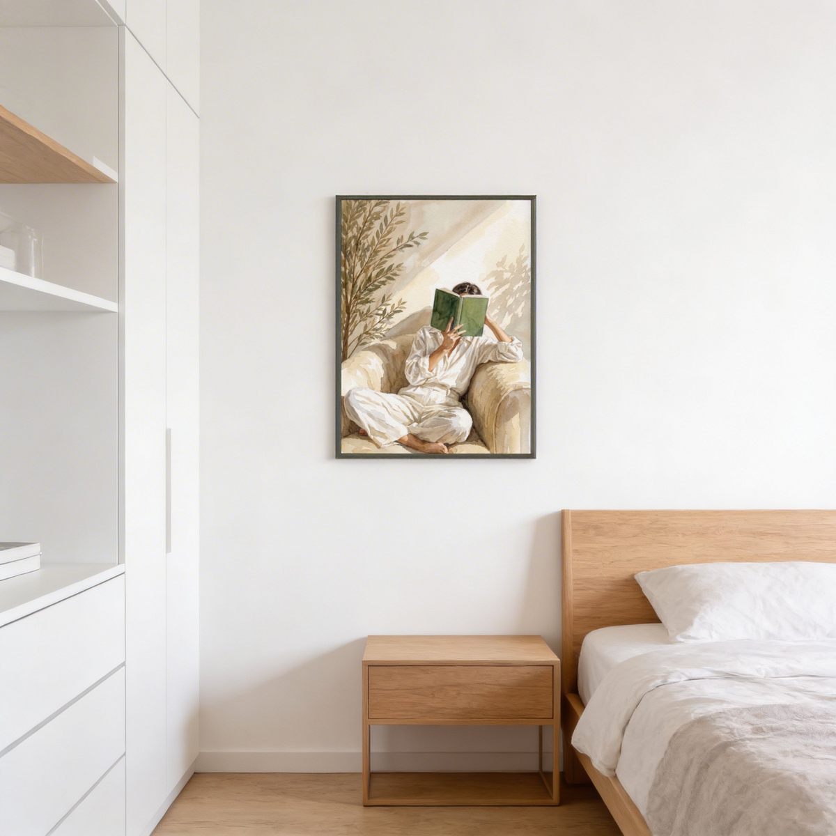 Soft watercolor wall print showing figure in white clothing reading a green book