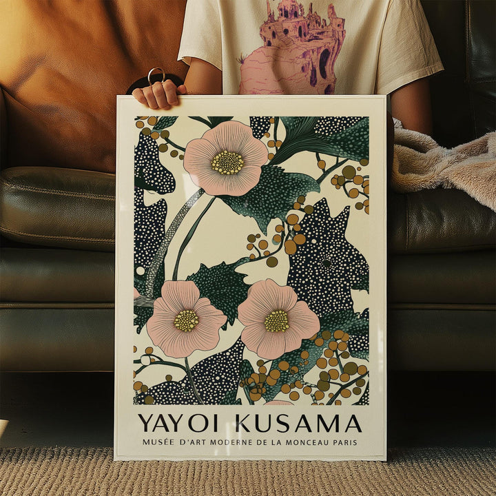 Print held in hands showing pink flowers with berries in botanical illustration style