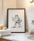 Minimal line illustration of a frog holding an open book art print