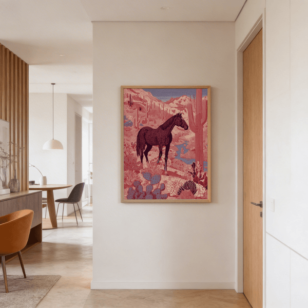 Carved-style mountains rising behind a silhouetted horse in limited palette