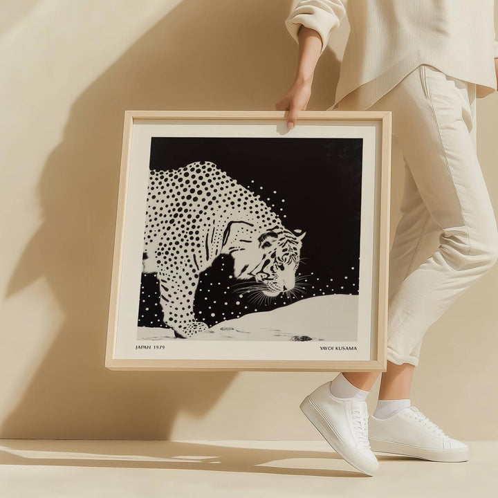 Framed Japanese Tiger Art print featuring a spotted tiger in black and white held by person in white clothing