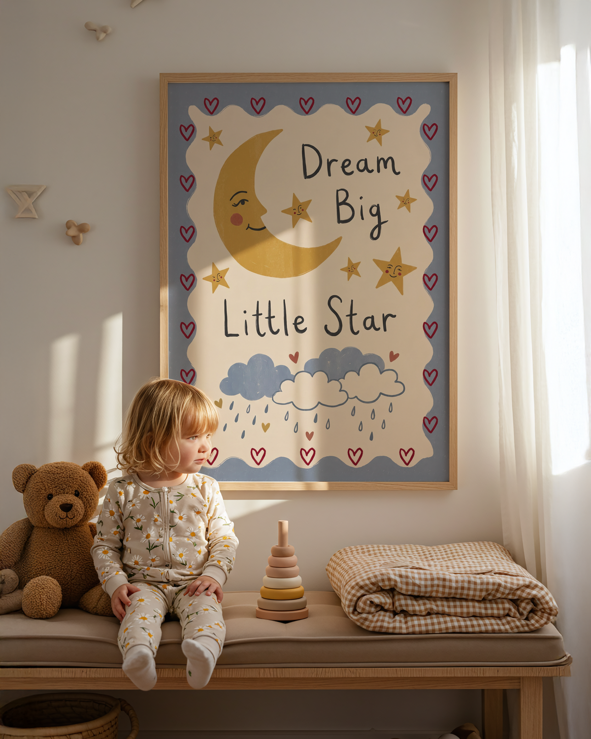 Nursery wall styled with Dream Big Poster and plush toys under soft light