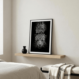 Black and white leopard wall art focusing on eyes, whiskers, and spots