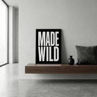 Bold black MADE over WILD vertical typography poster